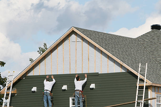 Professional Storm Damage Siding Repair technician working in Grassflat, PA